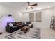 Comfortable living room featuring a plush gray sectional, modern decor, and stylish rug at 2660 S Equestrian Dr # 103, Gilbert, AZ 85295