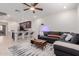 Open-concept living area with a modern kitchen, breakfast bar, and a comfortable seating area at 2660 S Equestrian Dr # 103, Gilbert, AZ 85295