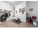 Basement with tiled floors and gym equipment at 26853 N 89Th Dr, Peoria, AZ 85383