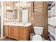 Bright bathroom featuring double sinks, a vanity mirror, and a shower/tub combination at 26853 N 89Th Dr, Peoria, AZ 85383