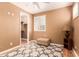 Comfortable bedroom featuring a walk-in closet, decorative rug, and wooden floors at 26853 N 89Th Dr, Peoria, AZ 85383