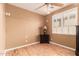 Empty bedroom with hardwood floors, minimalist furniture, a shuttered window, and neutral-colored walls at 26853 N 89Th Dr, Peoria, AZ 85383