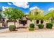 Inviting single-Gathering house with a landscaped front yard and a private gated entryway, set against a bright sky at 26853 N 89Th Dr, Peoria, AZ 85383