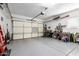 Spacious garage with an automatic door opener and ample storage and workspace at 26853 N 89Th Dr, Peoria, AZ 85383