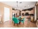 Eat-in kitchen featuring an island, wood cabinets, and a view of the dining area at 26853 N 89Th Dr, Peoria, AZ 85383