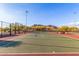 The community tennis court is surrounded by mountain views and desert landscaping at 26853 N 89Th Dr, Peoria, AZ 85383