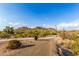 Dirt path leading to a paved walking path and playground at 26853 N 89Th Dr, Peoria, AZ 85383