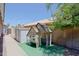 Backyard showcasing a playhouse, shed, and greenery at 287 W Liberty Ln, Gilbert, AZ 85233