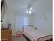 Comfortable bedroom with ceiling fan, natural light and carpet floors at 287 W Liberty Ln, Gilbert, AZ 85233