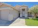 Inviting home exterior with a welcoming front porch and a lush green lawn at 287 W Liberty Ln, Gilbert, AZ 85233