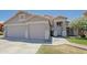 Charming single Gathering home with a well-manicured lawn, three car garage, and a welcoming entrance at 287 W Liberty Ln, Gilbert, AZ 85233