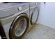 This laundry area features a Samsung washer and dryer, with a gray and black color scheme at 287 W Liberty Ln, Gilbert, AZ 85233
