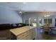 Open floor plan with kitchen island, dining area, and living room at 287 W Liberty Ln, Gilbert, AZ 85233