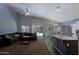 Spacious living room with vaulted ceilings and access to outdoor living at 287 W Liberty Ln, Gilbert, AZ 85233