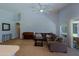 Bright living room featuring comfortable sofa and access to outdoor spaces at 287 W Liberty Ln, Gilbert, AZ 85233