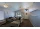 Cozy living room with vaulted ceilings, comfortable armchairs, and natural light from the front window at 287 W Liberty Ln, Gilbert, AZ 85233