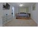 Comfortable main bedroom with a spacious layout, TV, and plenty of closet space at 287 W Liberty Ln, Gilbert, AZ 85233