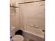 Bright bathroom featuring a shower with white tile, and a functional toilet at 3002 W Tonopah Dr, Phoenix, AZ 85027