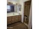 Modest bathroom with traditional vanity and connected access to the shower and toilet at 3002 W Tonopah Dr, Phoenix, AZ 85027