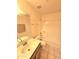 Bright bathroom featuring a single sink vanity, toilet and shower-tub combo with white tiled surround at 3002 W Tonopah Dr, Phoenix, AZ 85027