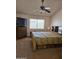 Spacious bedroom with ceiling fan, window, and dresser with mounted television at 3002 W Tonopah Dr, Phoenix, AZ 85027