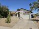 Charming single-story home featuring a well-maintained yard and attached garage in quiet neighborhood at 3002 W Tonopah Dr, Phoenix, AZ 85027