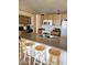 Kitchen showcases a breakfast bar, white appliances, and wood-look cabinetry at 3002 W Tonopah Dr, Phoenix, AZ 85027