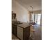 Eat-in kitchen area featuring an island, dining table, barstool seating and access to the backyard at 3002 W Tonopah Dr, Phoenix, AZ 85027