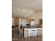 Bright eat-in kitchen featuring an island, updated lighting, modern appliances, and lots of cabinet space at 3002 W Tonopah Dr, Phoenix, AZ 85027