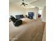 Spacious living area with recliner, sofa, and television offers a cozy entertainment space at 3002 W Tonopah Dr, Phoenix, AZ 85027