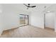 Bright bedroom features sleek ceiling fan, wood floors, and a large window with beautiful mountain views at 3434 E Baseline Rd # 265, Phoenix, AZ 85042