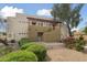 Inviting two-story condo featuring desert landscaping, covered stairs, and a private entrance at 3434 E Baseline Rd # 265, Phoenix, AZ 85042