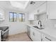 Modern kitchen features stainless steel appliances, sleek cabinets, and stylish tile backsplash at 3434 E Baseline Rd # 265, Phoenix, AZ 85042