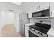 Modern kitchen features stainless steel appliances and sleek cabinets at 3434 E Baseline Rd # 265, Phoenix, AZ 85042