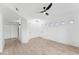 Bright living room features sleek ceiling fan, wood floors, and multiple windows at 3434 E Baseline Rd # 265, Phoenix, AZ 85042