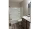 Bathroom features shower-tub combo, single sink vanity, and new flooring at 3810 N Maryvale Pkwy # 2061, Phoenix, AZ 85031