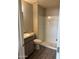 Bathroom features step-in shower, single sink vanity, and new flooring at 3810 N Maryvale Pkwy # 2061, Phoenix, AZ 85031