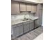 Kitchen features stainless steel appliances, double sink, and granite countertops at 3810 N Maryvale Pkwy # 2061, Phoenix, AZ 85031
