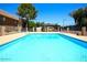 Inviting community pool with clear blue water and ample lounging space for residents' relaxation and enjoyment at 3810 N Maryvale Pkwy # 2061, Phoenix, AZ 85031