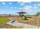 Community playground with a shaded play structure, swings, a bench, and mountain views at 3916 S 98Th Ln, Tolleson, AZ 85353