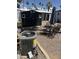 View of backyard area with shed, patio furniture, and air conditioning unit at 4065 E University Dr # 242, Mesa, AZ 85205