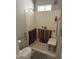 Functional bathroom with walk-in shower, safety bars, and shower seat, prioritizing accessibility and convenience at 4065 E University Dr # 242, Mesa, AZ 85205
