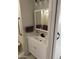 Neat bathroom featuring a vanity with white cabinets, sleek faucet, and medicine cabinet mirror for ample storage at 4065 E University Dr # 242, Mesa, AZ 85205
