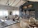 Community library featuring comfortable seating, a cozy fireplace, and a well-stocked bookshelf at 4065 E University Dr # 242, Mesa, AZ 85205