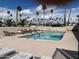 Community pool with ample lounge chairs for relaxation at 4065 E University Dr # 242, Mesa, AZ 85205
