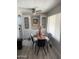 Bright dining area with neutral decor, contemporary ceiling fan, ample natural light, and built-in shelving at 4065 E University Dr # 242, Mesa, AZ 85205