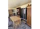 Dining room with wooden table and chairs, sliding glass door, and dark wood shelving at 4065 E University Dr # 242, Mesa, AZ 85205