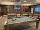 Spacious game room featuring several pool tables and stylish lighting at 4065 E University Dr # 242, Mesa, AZ 85205
