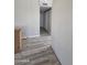 Hallway featuring modern laminate flooring and neutral paint at 4065 E University Dr # 242, Mesa, AZ 85205