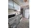 Well-equipped kitchen boasts a microwave, oven, and a refrigerator at 4065 E University Dr # 242, Mesa, AZ 85205